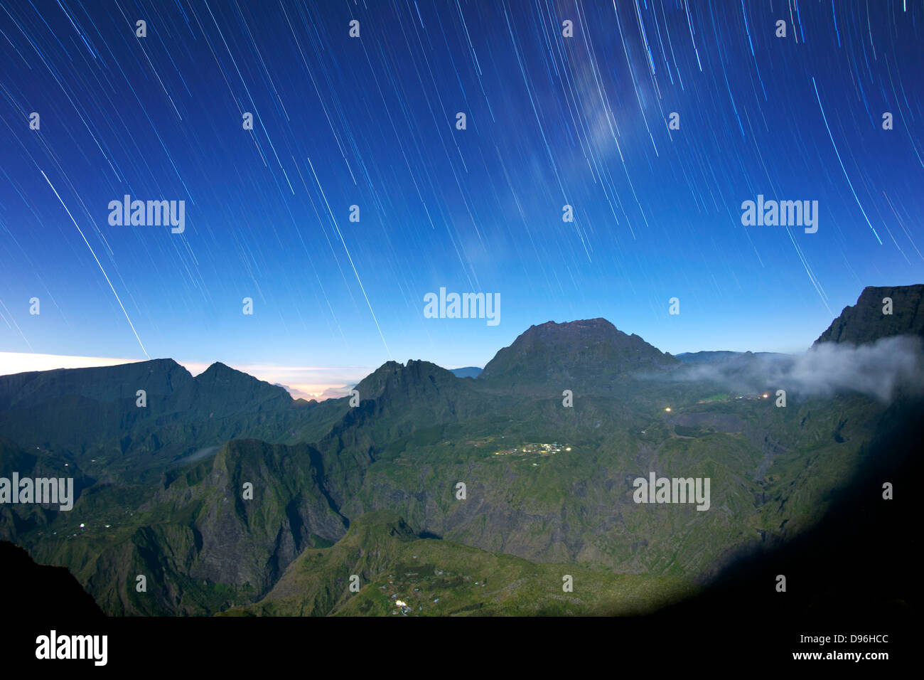 Star trails over the Cirque de Mafate caldera on the French island of Reunion in the Indian Ocean. Stock Photo