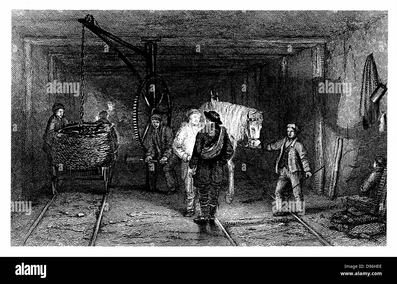 Coal Mining: Underground scene showing full baskets (corves) of coal being loaded on a tram wagon using a crane. Pit ponies used to haul coal  underground.  From W Fordyce 'A History of Coal, Coke, Coal Fields ...' London 1860. Engraving. Stock Photo
