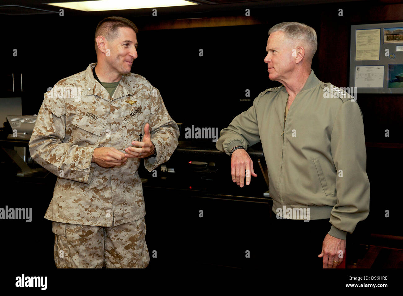 The 35th commandant of the Marine Corps, General James F. Amos, right, speaks with Lt. Col. David R. Berke while visiting the Marine Fighter Attack Training Squadron 501 (VMFAT-501) at Eglin Air Force Base, FL, May 4, 2013. VMFAT-501 is a newly reactivate Stock Photo