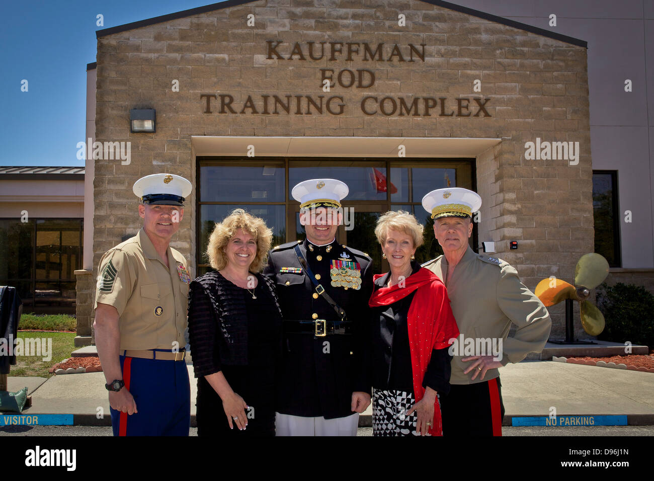 The 35th Commandant of the Marine Corps, Gen. James F. Amos, right; Marine Corps First Lady Bonnie Amos, second from right; and Stock Photo