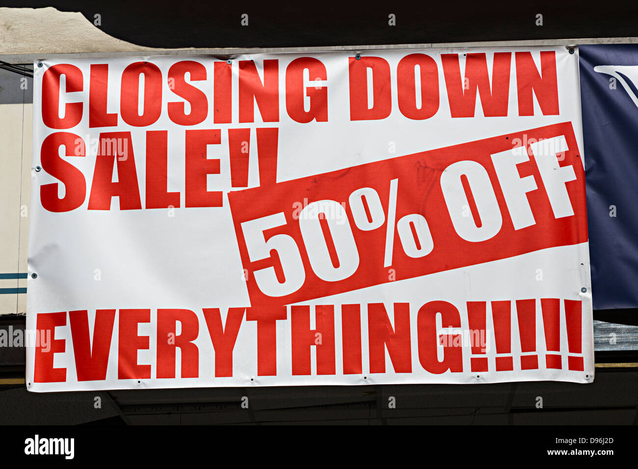 Closing down sale, 50% off everything, sign over shop window, UK Stock Photo