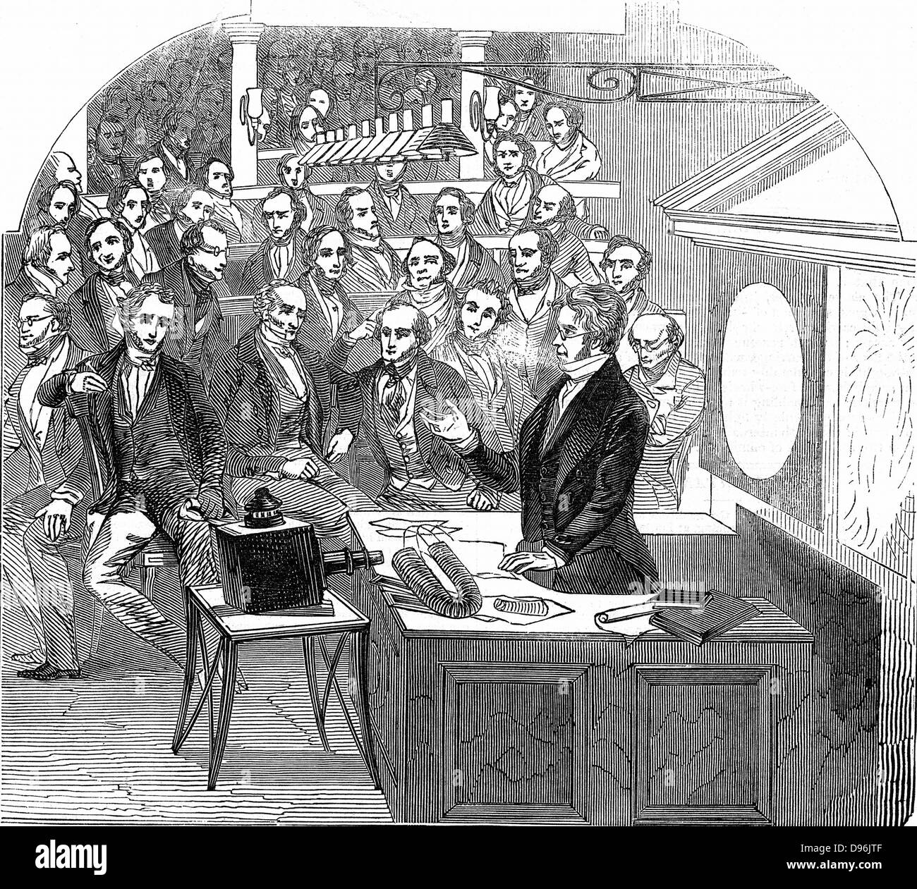 Michael Faraday (1791-1867) British chemist and physicist, lecturing on electricity and magnetism Royal Institution, London, 23 January 1846. Wood engraving. Stock Photo