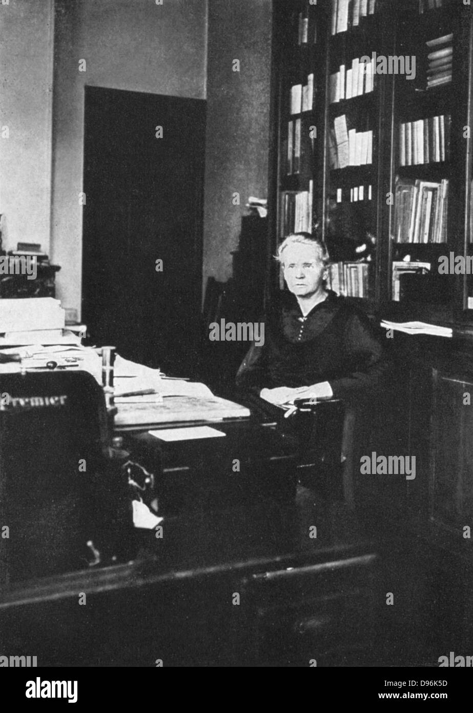 Marie Curie (1867-1934) Polish-born French physicist in 1925 in her office at the Radium Institute, Paris, of which she was director of research from 1918-1934 Stock Photo