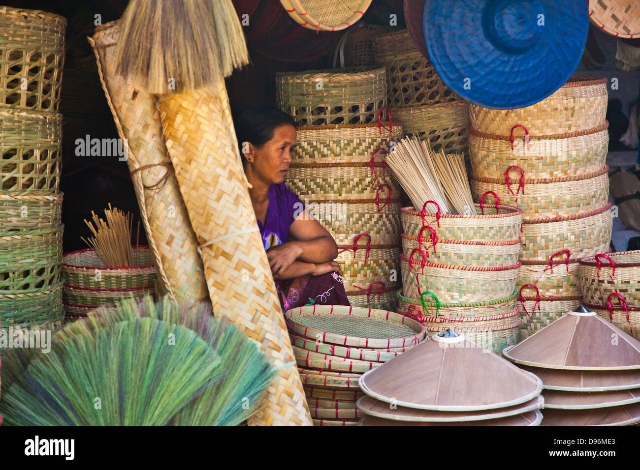 BAMBOO BROOMS, HATS and BASKETS are sold at the CENTRAL MARKET in KENGTUNG also known as KYAINGTONG - MYANMAR Stock Photo