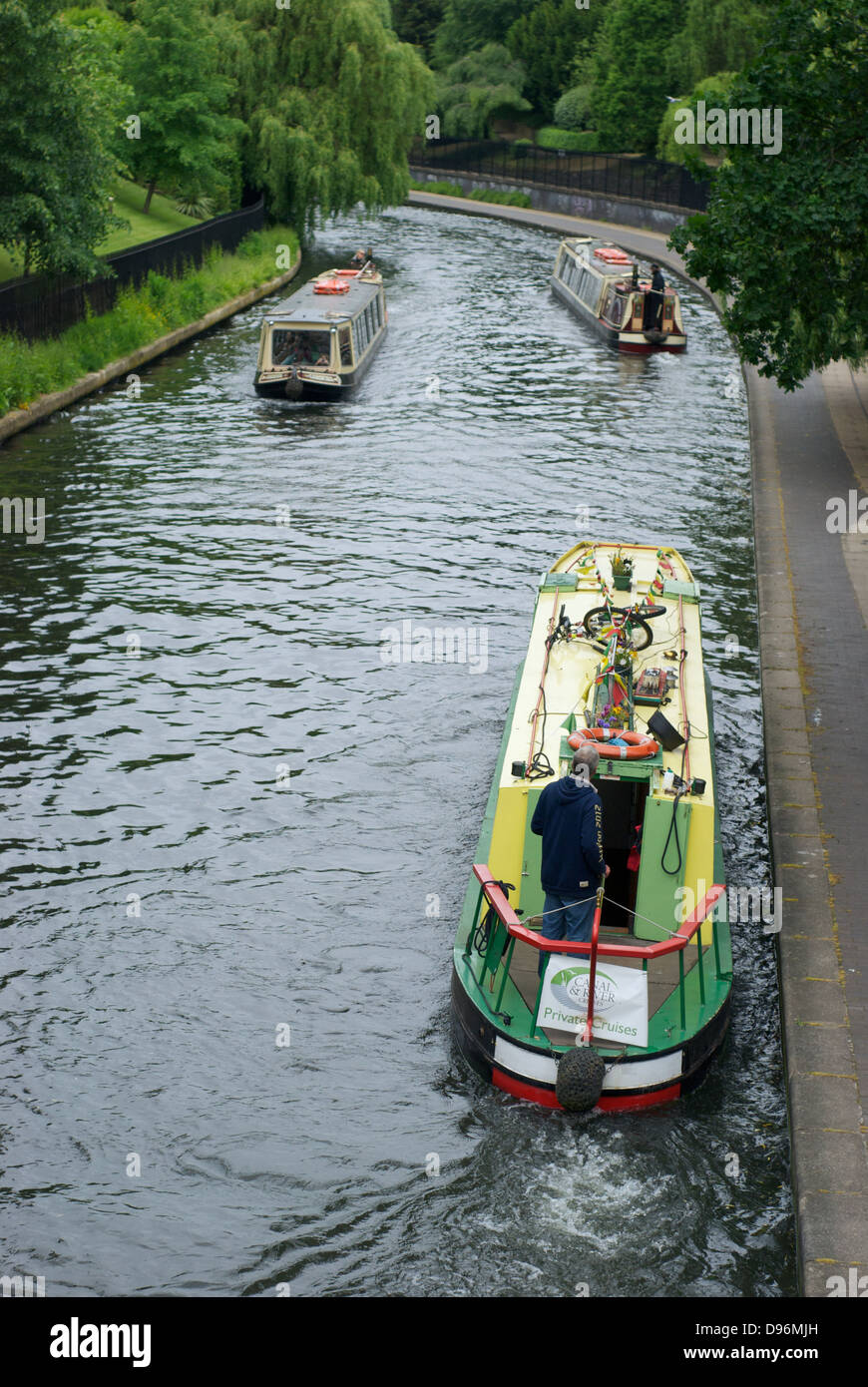London canal boat tours barges ply their trade on the canal alongside