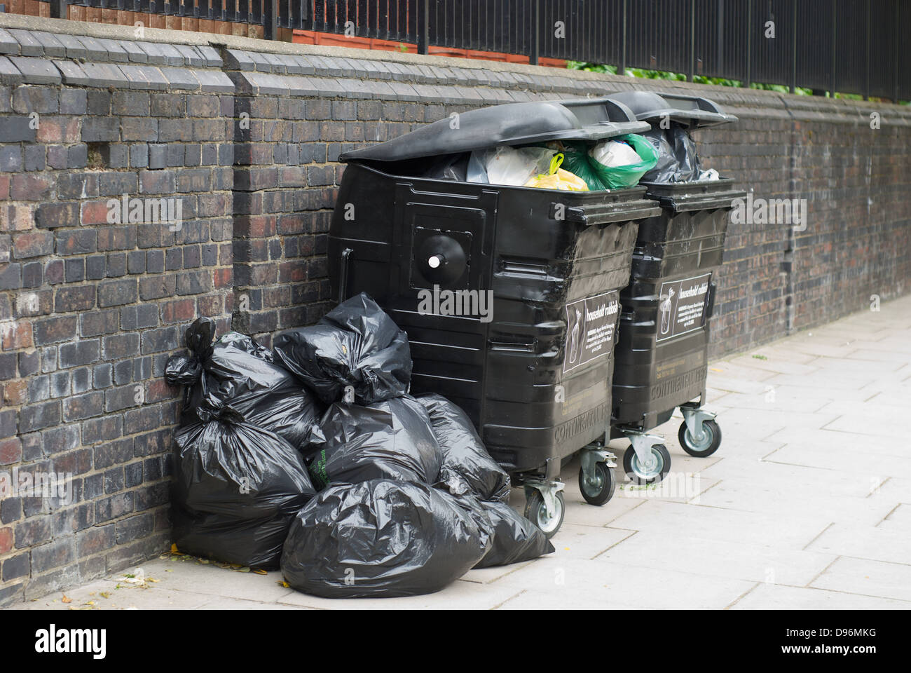 Overloaded rubbish bins in St. John's Wood London UK Stock Photo Alamy