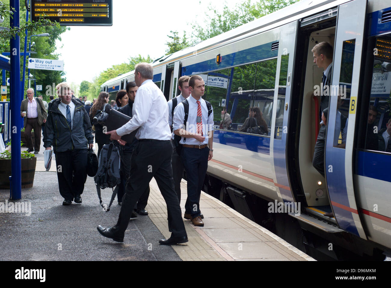 Passengers getting on and off a London bound train from Warwick station Stock Photo