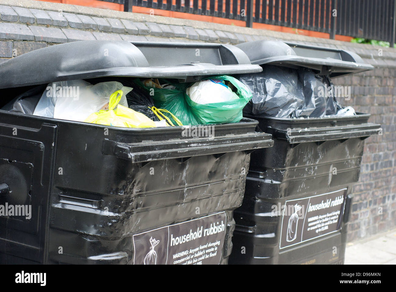 Overloaded rubbish bins in St. John's Wood London UK Stock Photo Alamy