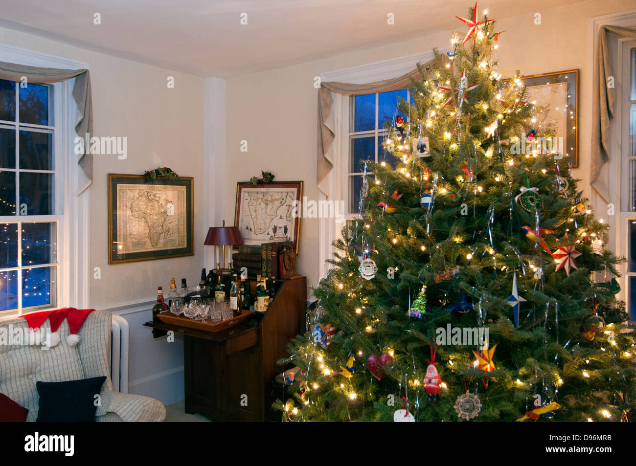 Illuminated Christmas tree in domestic room Stock Photo