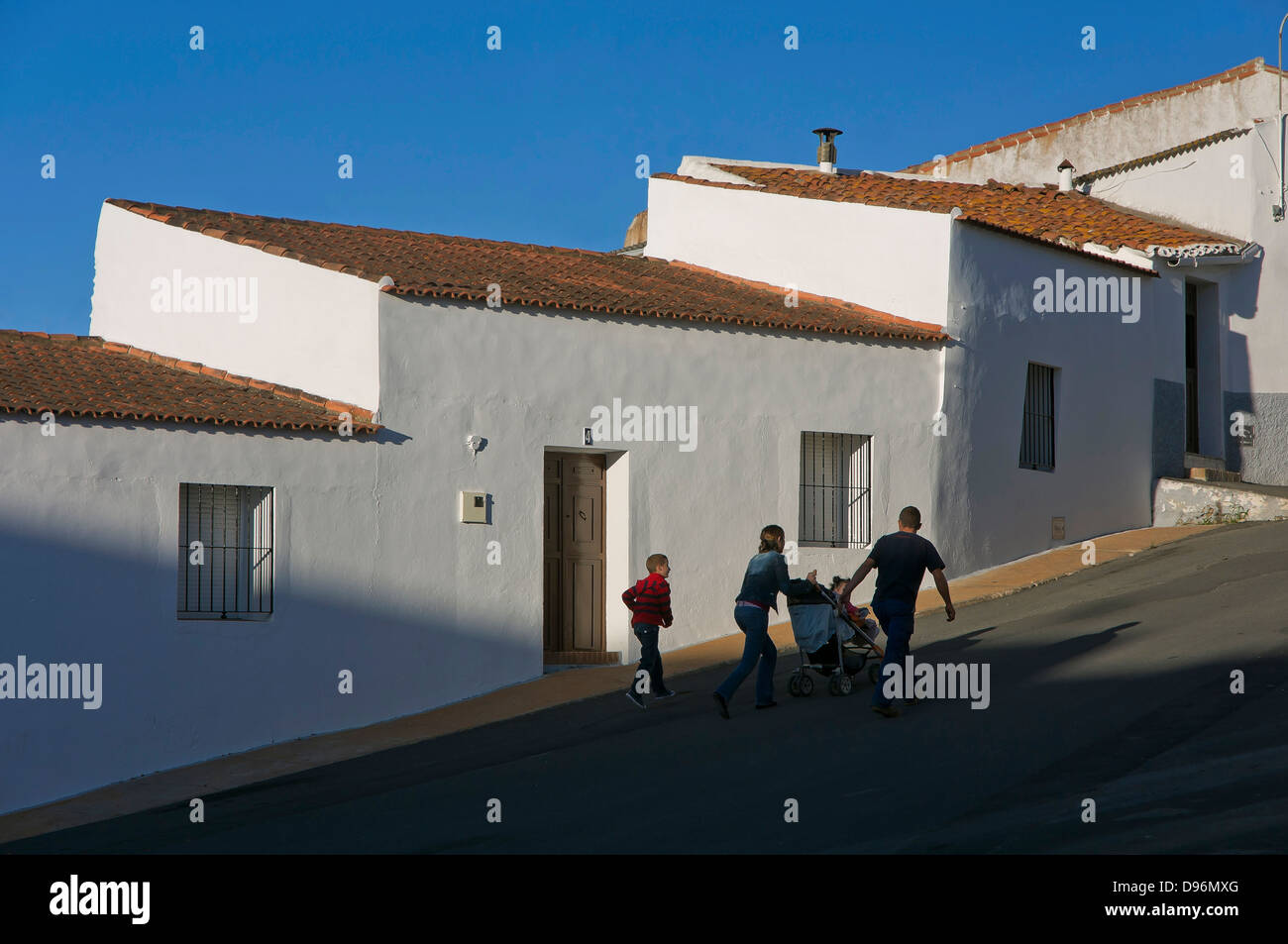 Urban view and family, Alosno, Huelva-province, Region of Andalusia, Spain, Europe Stock Photo