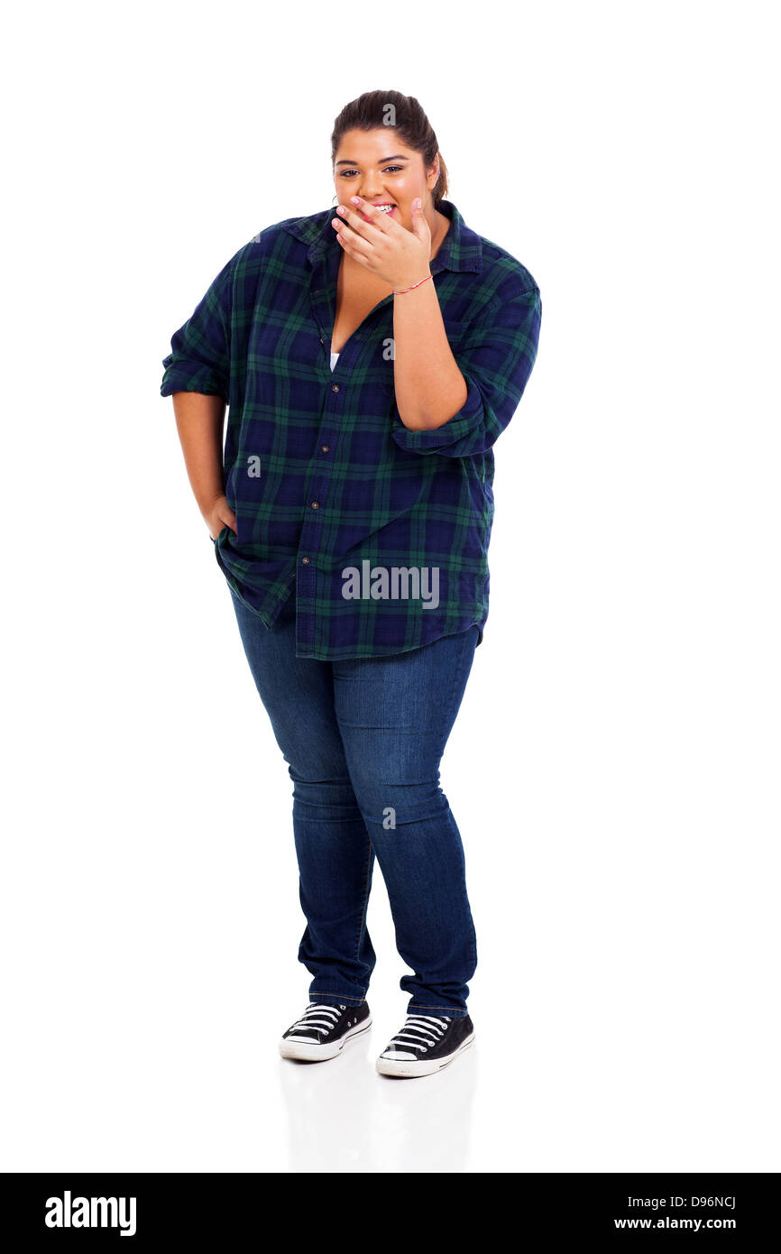 overweight young woman laughing and covering her mouth Stock Photo