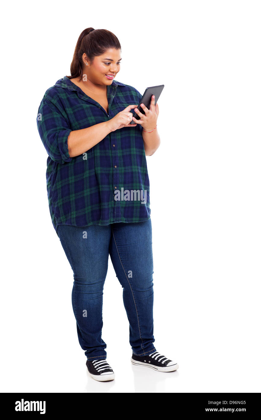 beautiful overweight female college student using tablet computer isolated on white background Stock Photo