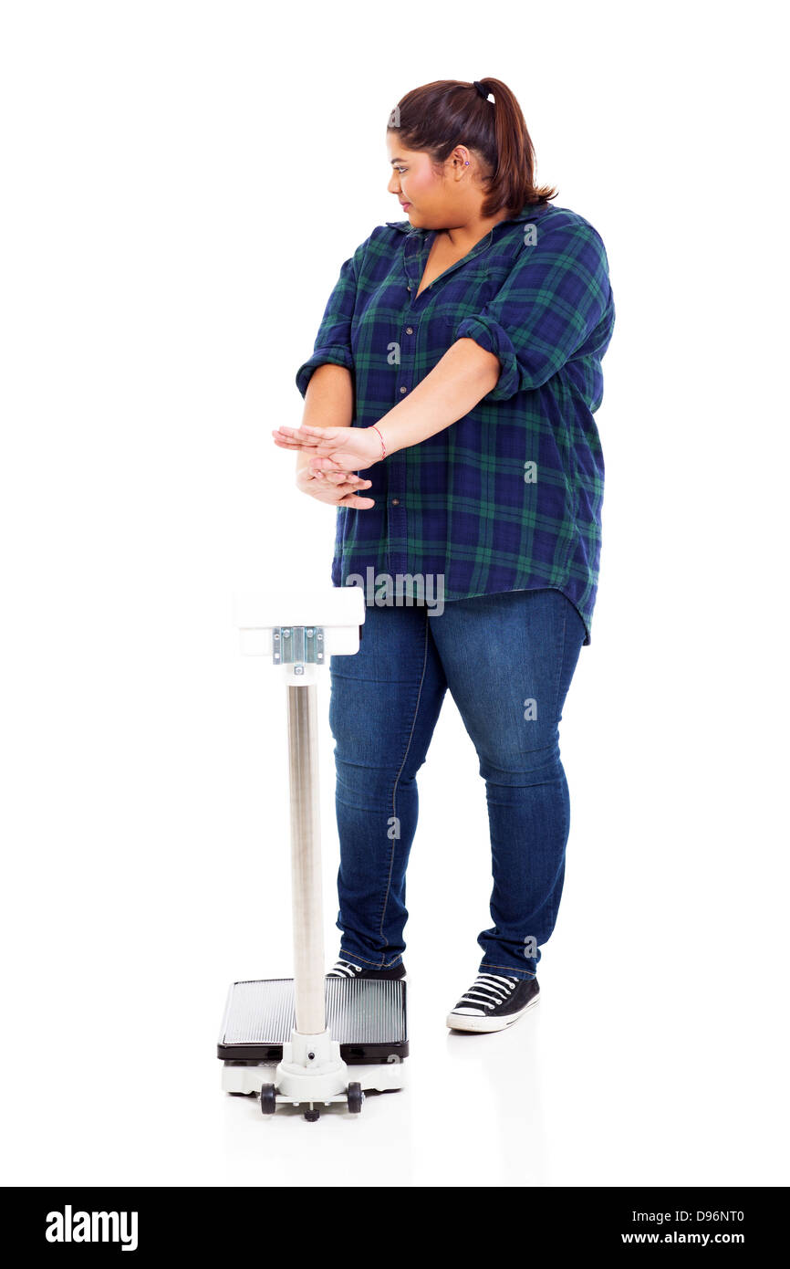 overweight woman refuse to go on scale for weighting Stock Photo