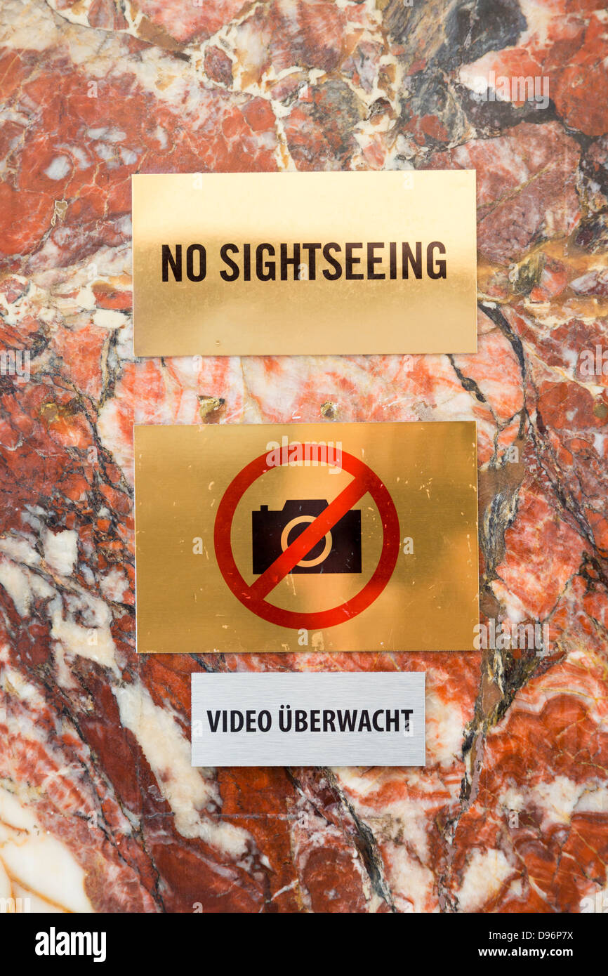 sign 'No Sightseeing' and video überwacht (video surveillance) on wall of American Bar, Vienna, Austria Stock Photo