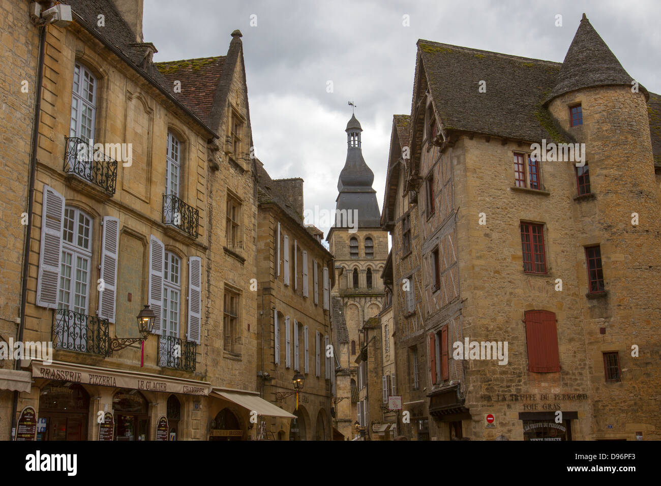Beautiful medieval sandstone buildings and bell tower of Saint-Sacerdos Cathedral in charming Sarlat, Dordogne region of France Stock Photo