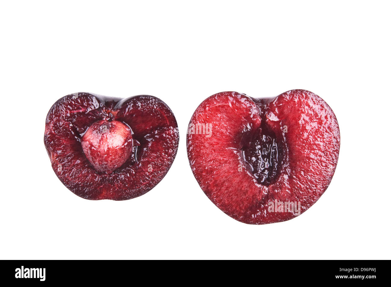fresh cherry cut in halves isolated on white Stock Photo