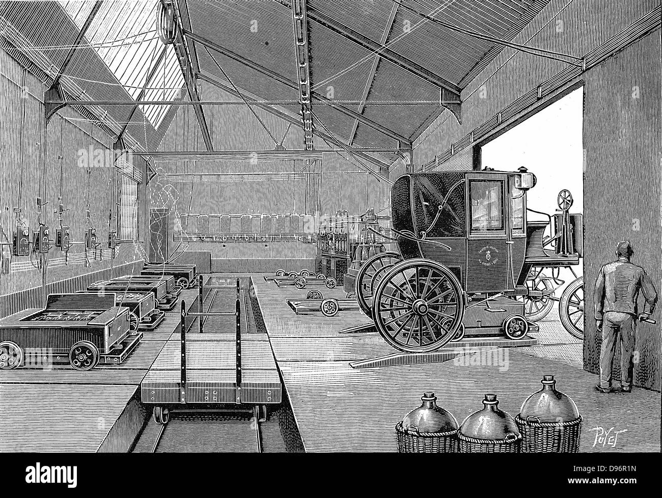 Depot at Rue Cardinet where electrically driven Paris cabs were fitted with freshly charged batteries. At front right are glass carboys in protective wicker jackets. These contained acid used in batteries  From 'La Nature' Paris 1899. Stock Photo