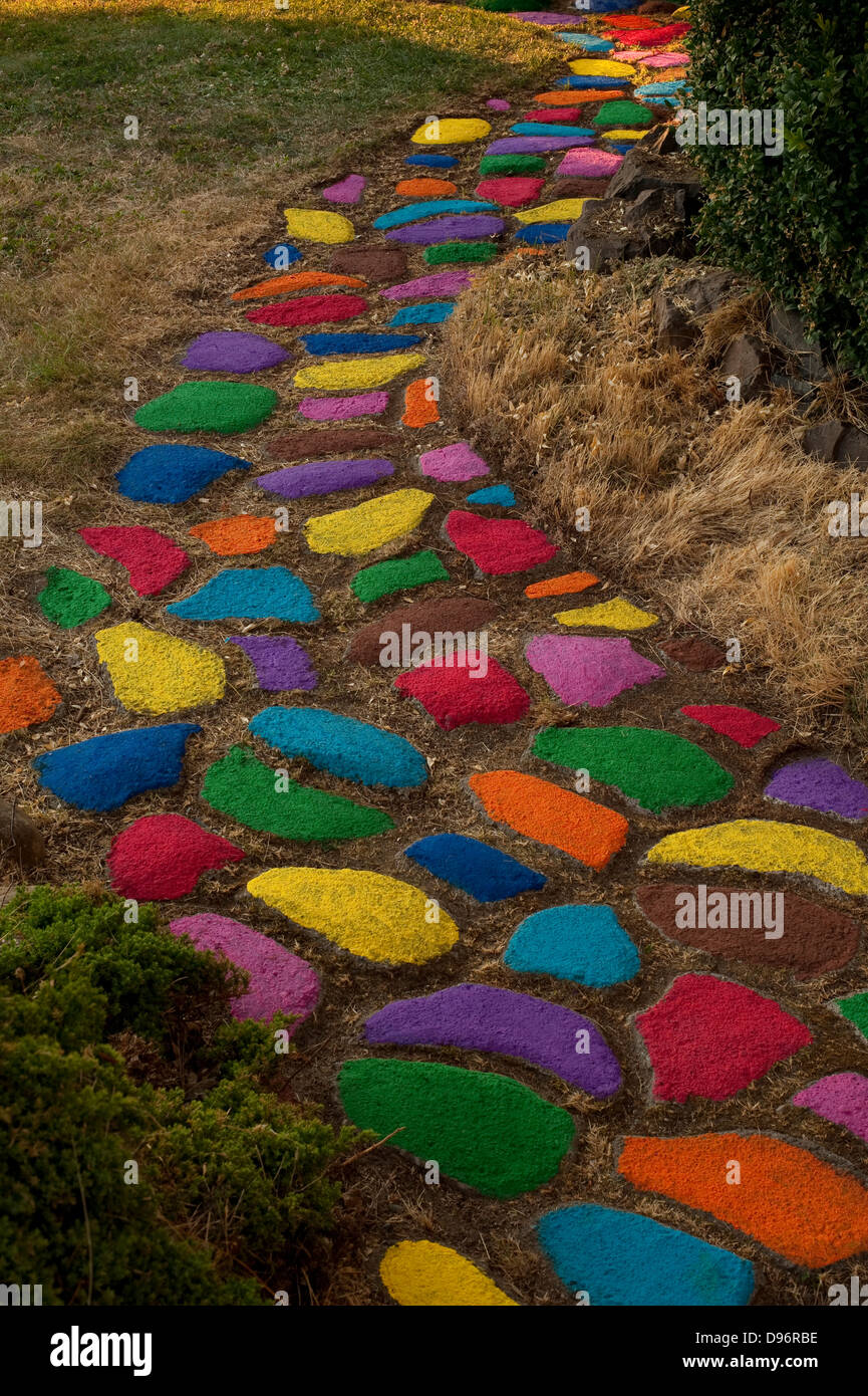 Rock path through yard with rocks multicolored Stock Photo