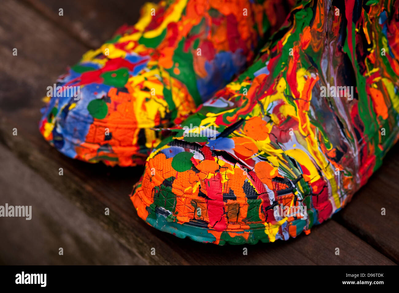 Galoshes, boots covered with peeling dripping paint Stock Photo - Alamy