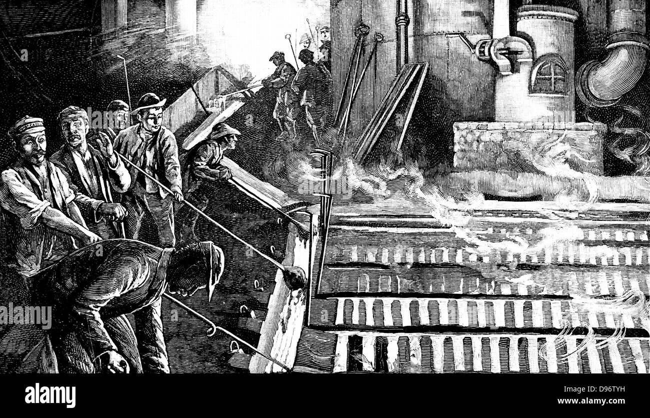 Tapping blast furnace and casting iron into pigs hires stock