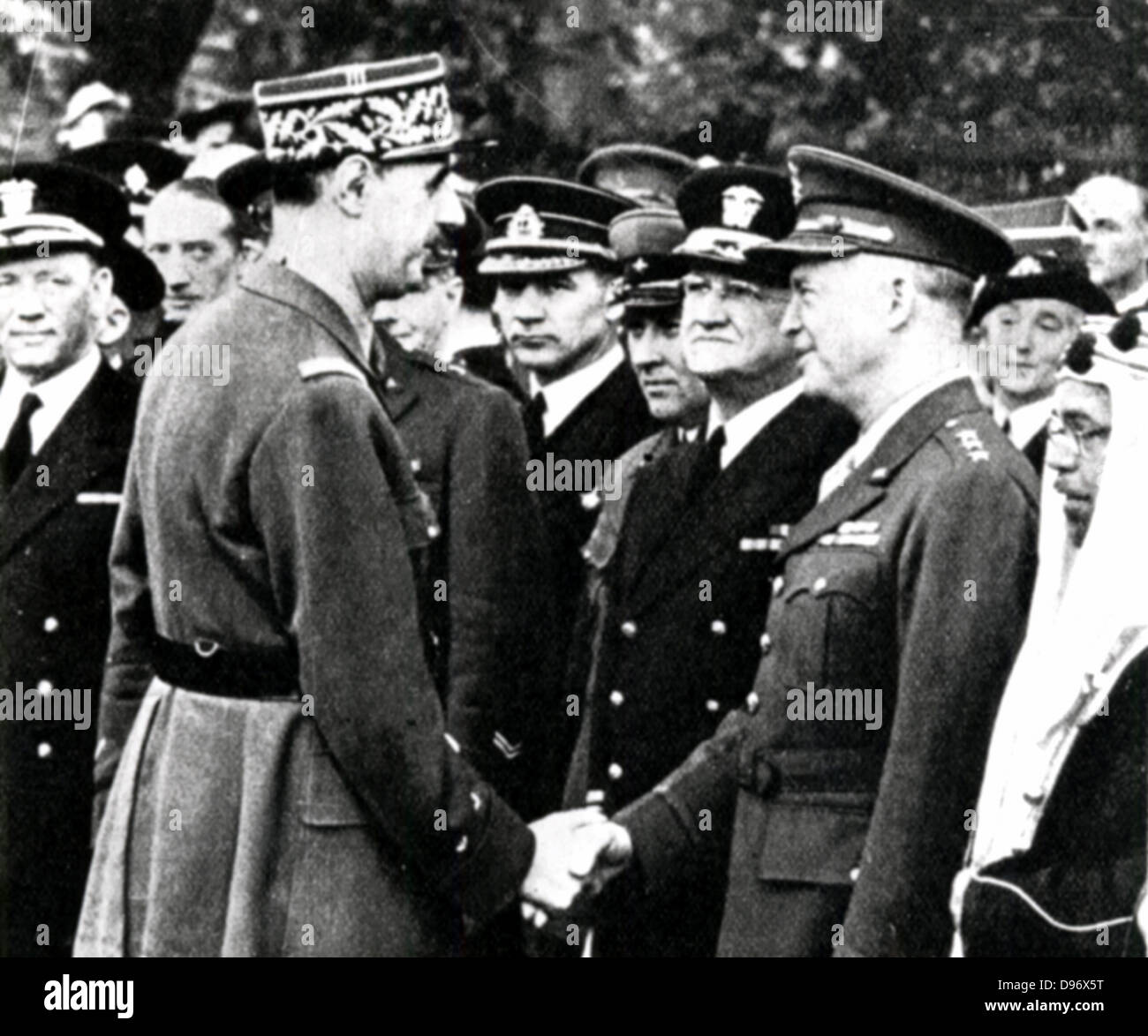 Charles de Gaulle (1890-1970) French General and first President of The Fifth Republic. General de Gaulle greets allied commanders in France including General Dwight Eisenhower (1890-1969) during World War II. Photograph. Stock Photo