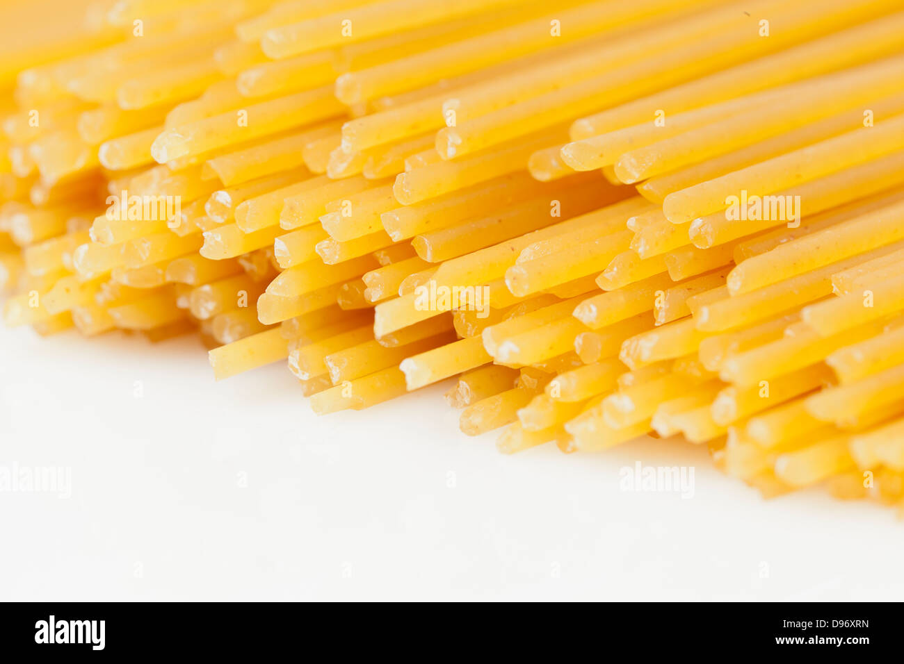 A Bundle of dry spaghetti ready to cook Stock Photo Alamy