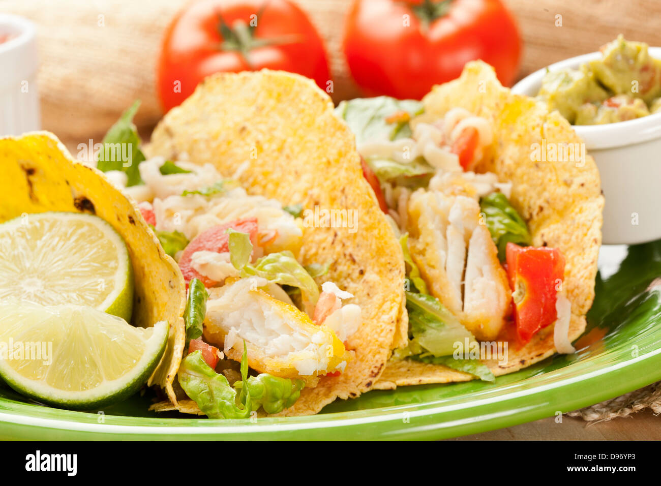 Homemade fresh fish tacos on a green plate Stock Photo