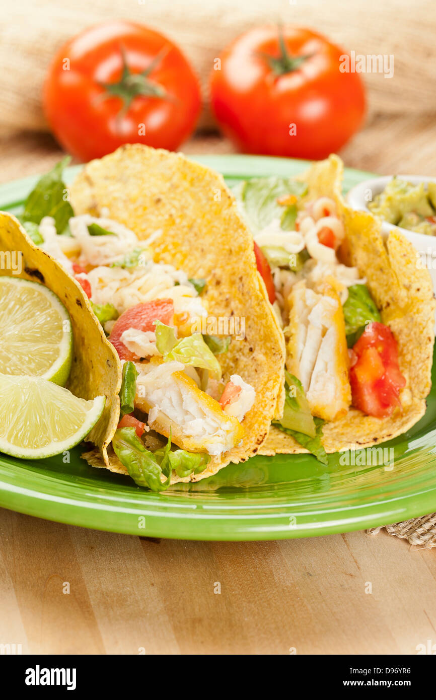 Homemade fresh fish tacos on a green plate Stock Photo