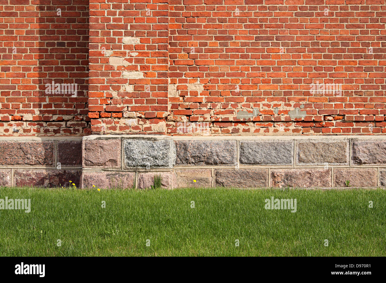Green grass before an ancient stone wall Stock Photo - Alamy