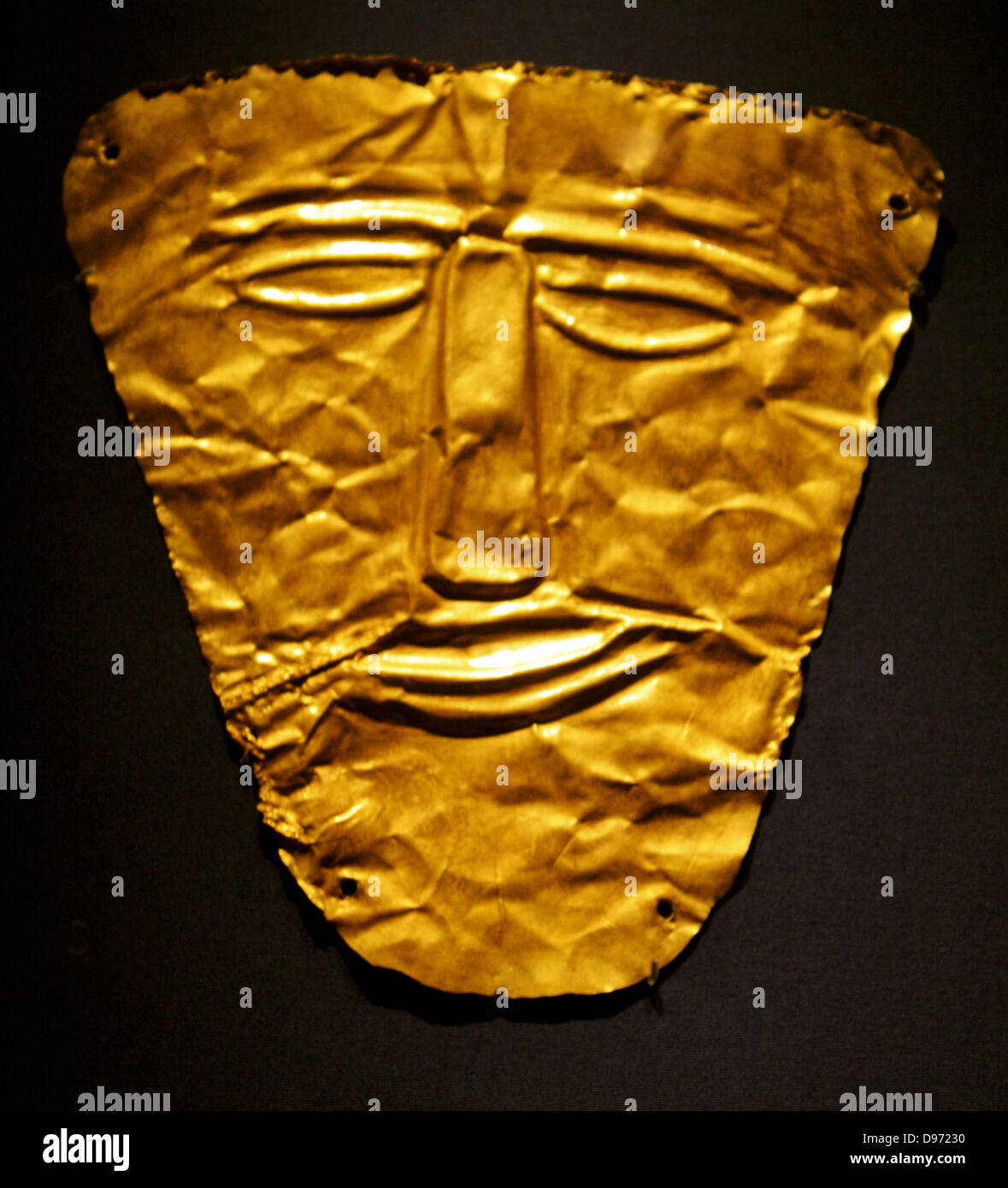 Gold eye and mouth covers. These objects were probably placed over the shrouded faces of corpses placed in the graves and attached by a cord running through the corners. 1st century AD Stock Photo