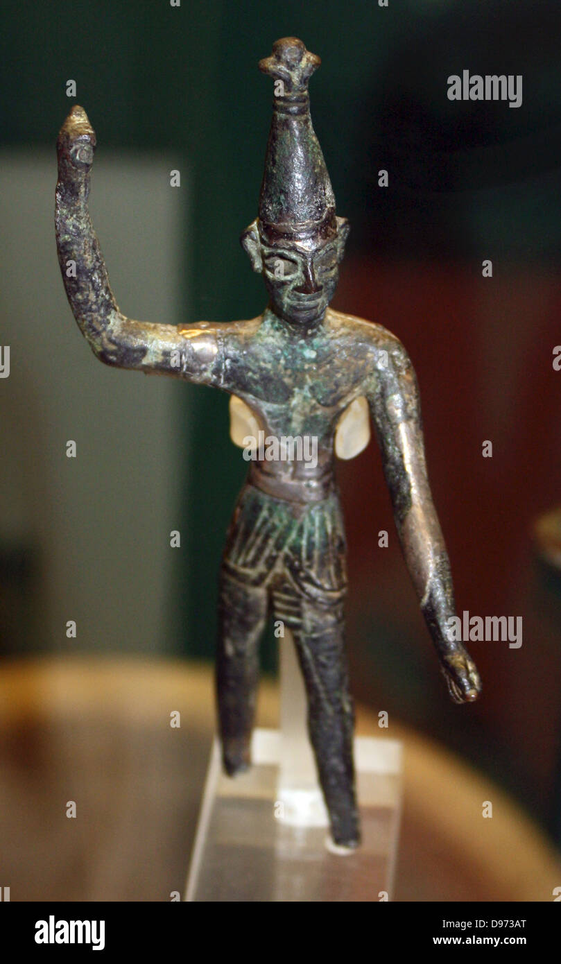 Bronze figures with silver overlay. LBII (1400-1200 BC) From Tyre Possibly represents the Canaanite god Baal in the role warrior. Stock Photo