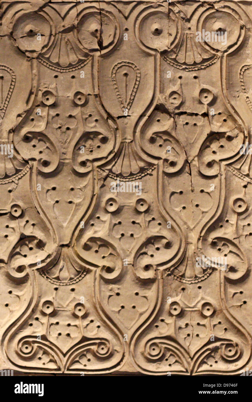Wall paper made from stucco : interiors from houses and palaces. Particularly famous for Samarra is its carved stucco, with once decorated the dadoes of houses and palaces. There are three different styles. Two styles show vine leaves, grapes and leaf tendrils closely follow the tradition of Late Antiquity. There is then the flat cut 'bevelled' or 'slant' style of carving with stylised ornaments repeated in endless series. This was a ground-breaking invention and widely used in the Abbasid Empire in the 9th and 10th century. Stock Photo