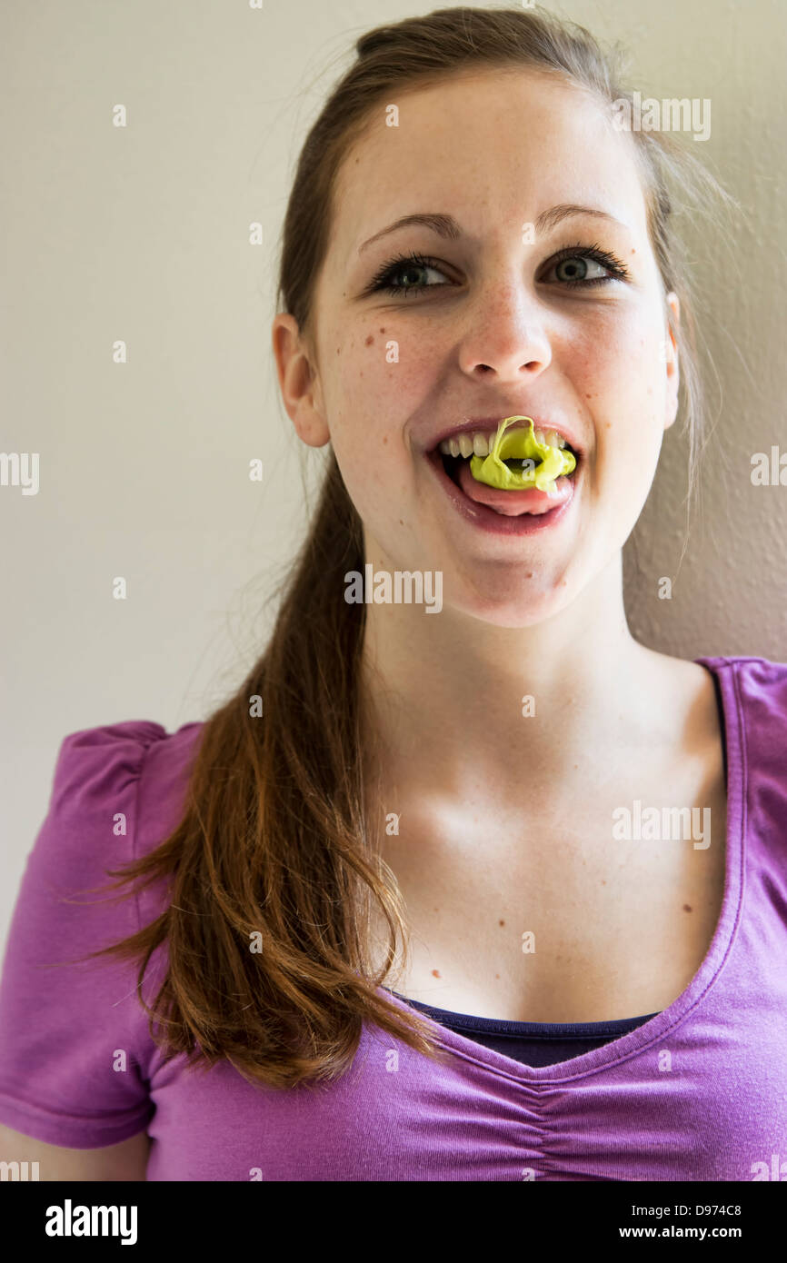 Germany, Teenage girl chewing bubble gum Stock Photo Alamy