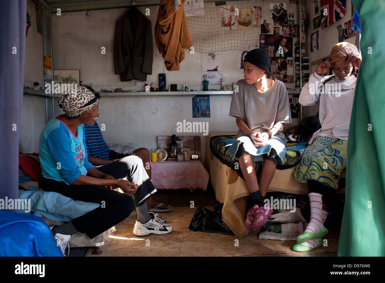 <p>Shirley friends chat in one-bedroom tin home They were forcibly moved to Blikkiesdorp after living in Seapoint 15 years Stock Photo
