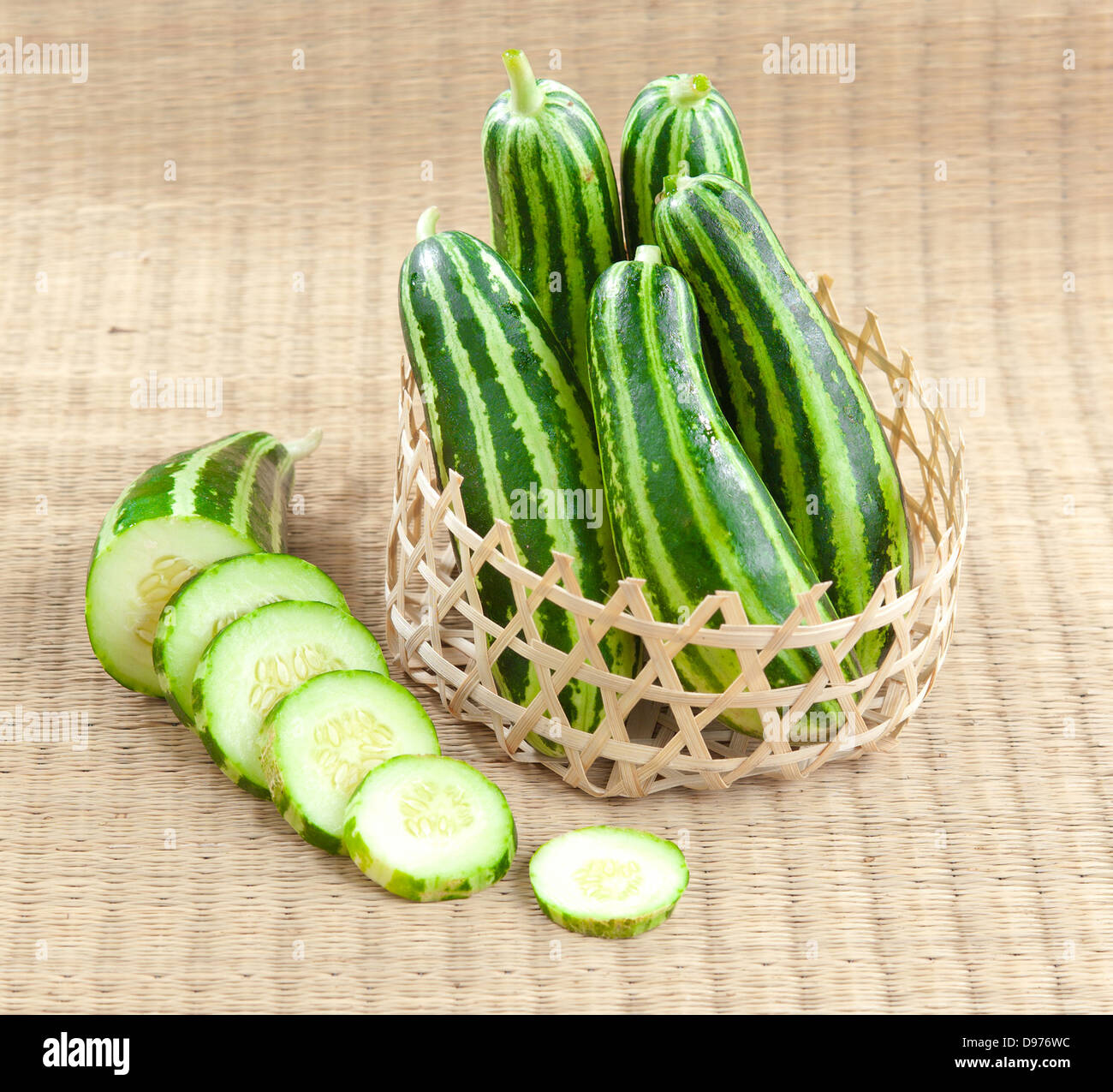 Clean cucumber sliced and display in the bamboo basket Stock Photo