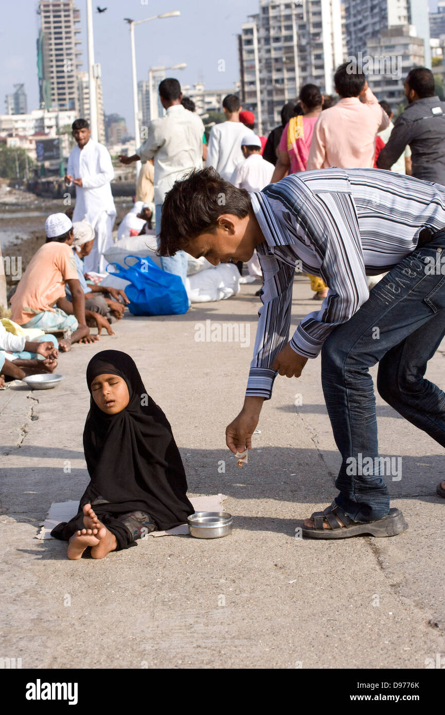 Giving Alms To Beggars High Resolution Stock Photography and Images - Alamy