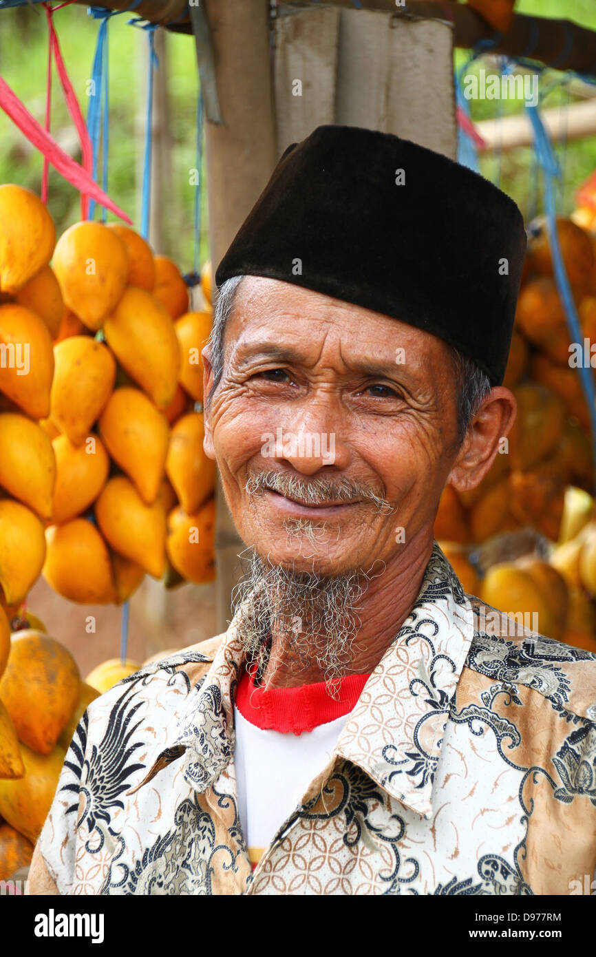 Friendly fruit seller in Java, Indonesia Stock Photo Alamy