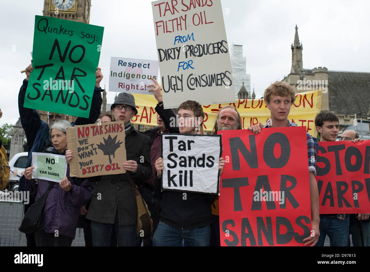 Westminster, London, UK. 13th June 2013. Parliament Square, London. A small but passionate groups of protesters await the arrival of Canadian Prime Minister, Stephen Harper. Harper is addressing both Houses of Parliament. He is lobbying against an EU climate legislation keeping tar sands out of Europe due to the impact it will have on Climate. The anti-tar sands lobby has the backing of 25 trans-Atlantic groups including Greenpeace and Council of Canadians. Credit:  Allsorts Stock Photo/Alamy Live News Stock Photo