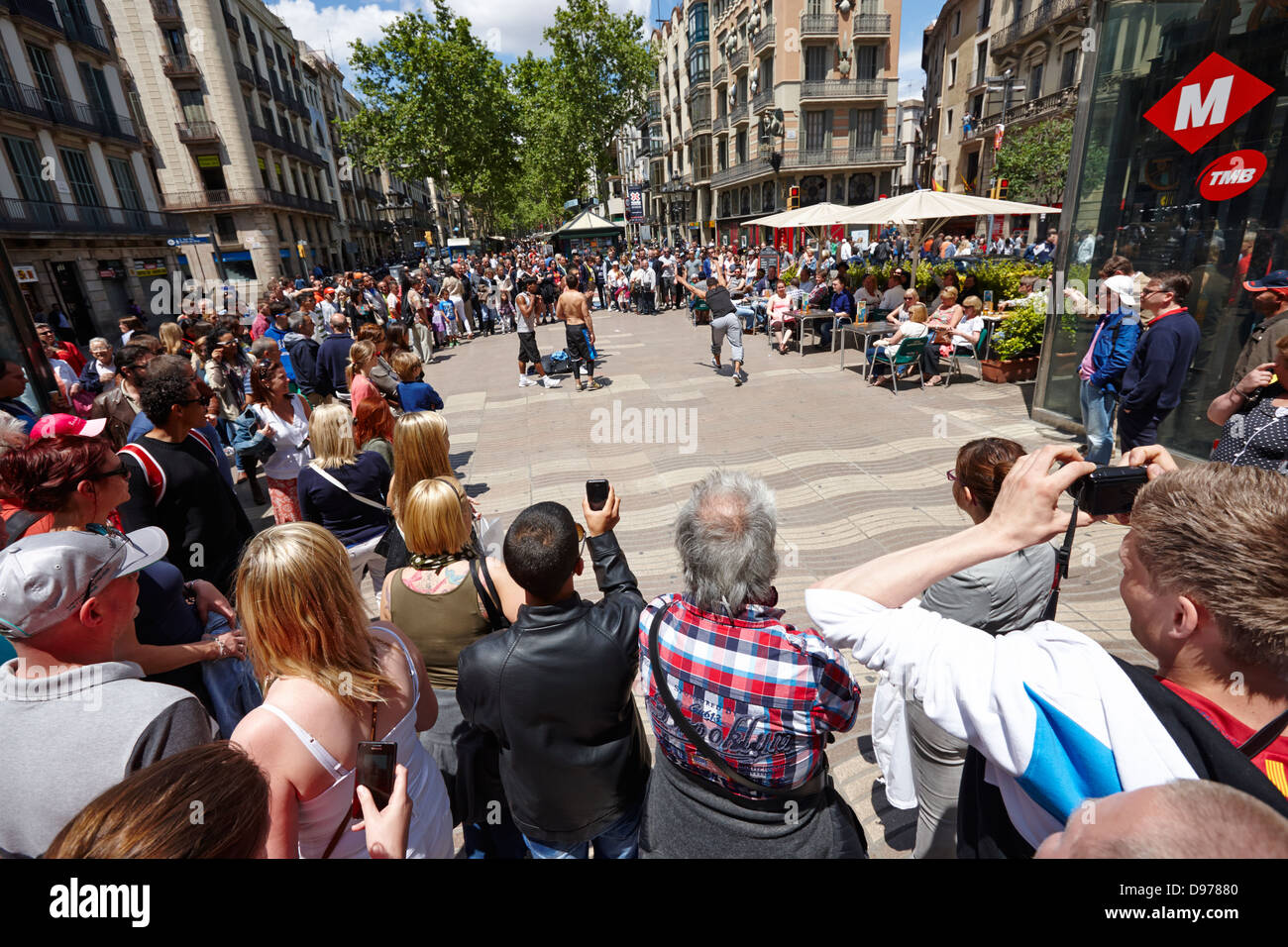 tourists with acrobat street performer group on la rambla barcelona catalonia spain Stock Photo