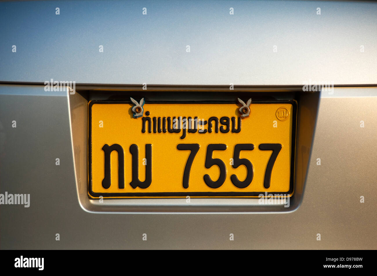 Horizontal close up view of a number plate in the Lao language. Stock Photo