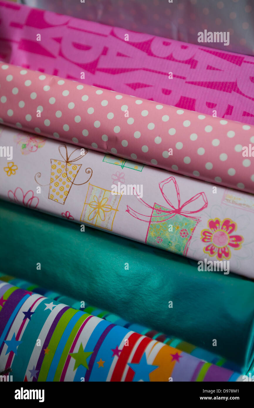 A pile of wrapped girls birthday presents Stock Photo
