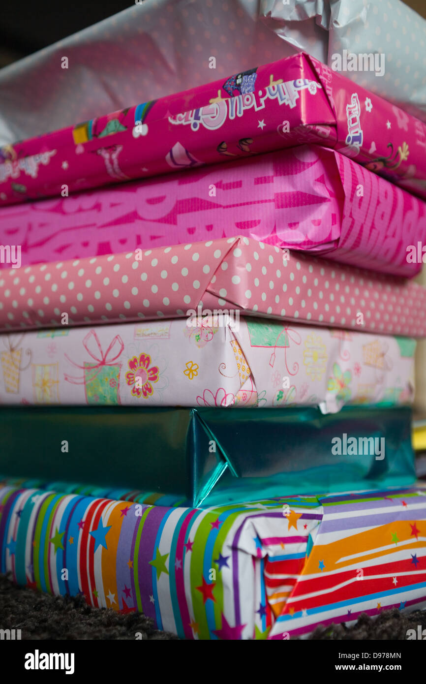 A pile of wrapped girl's birthday presents Stock Photo