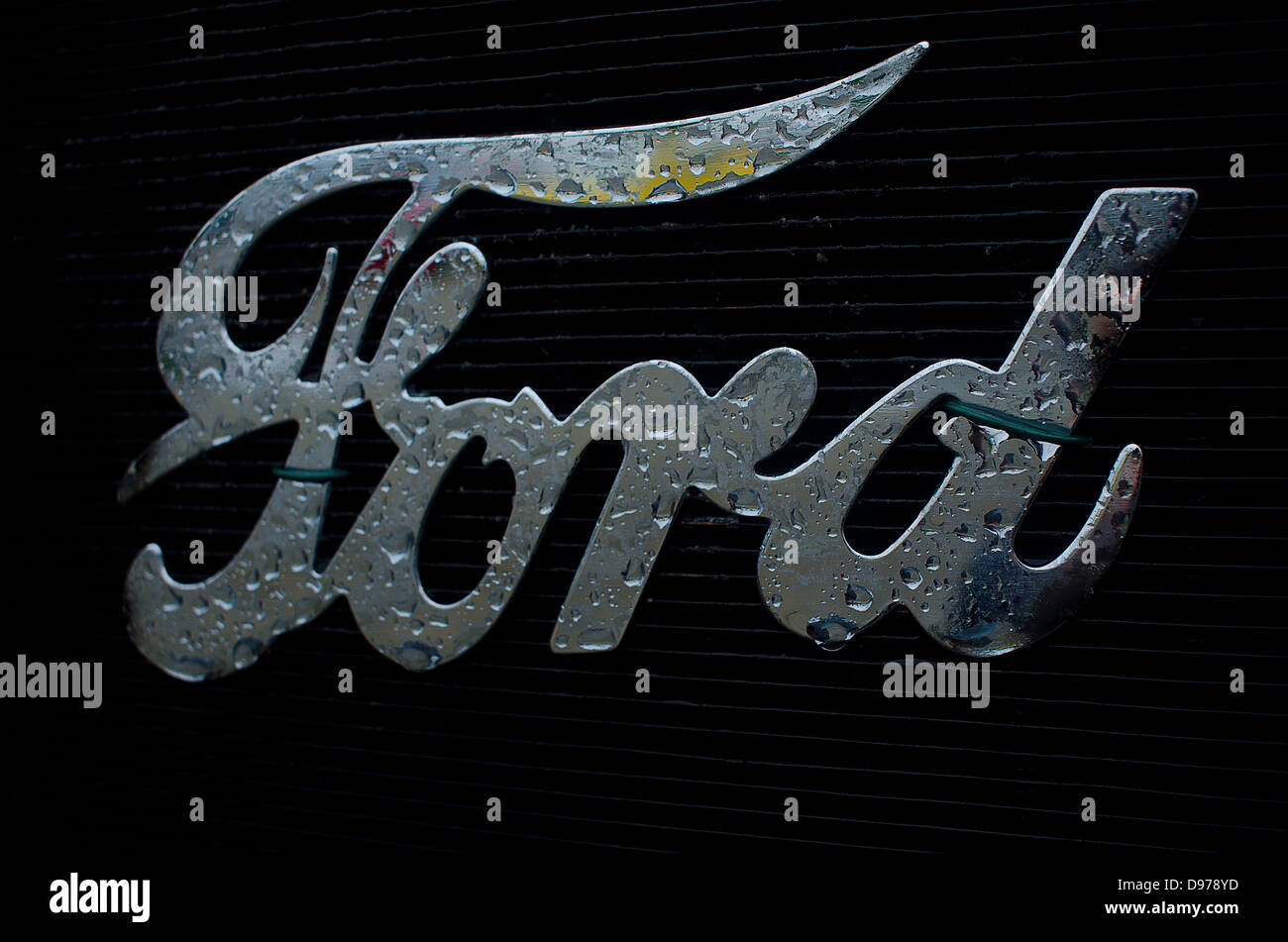 The Logo of Ford on the radiator of the classic T Model with raindrops Stock Photo