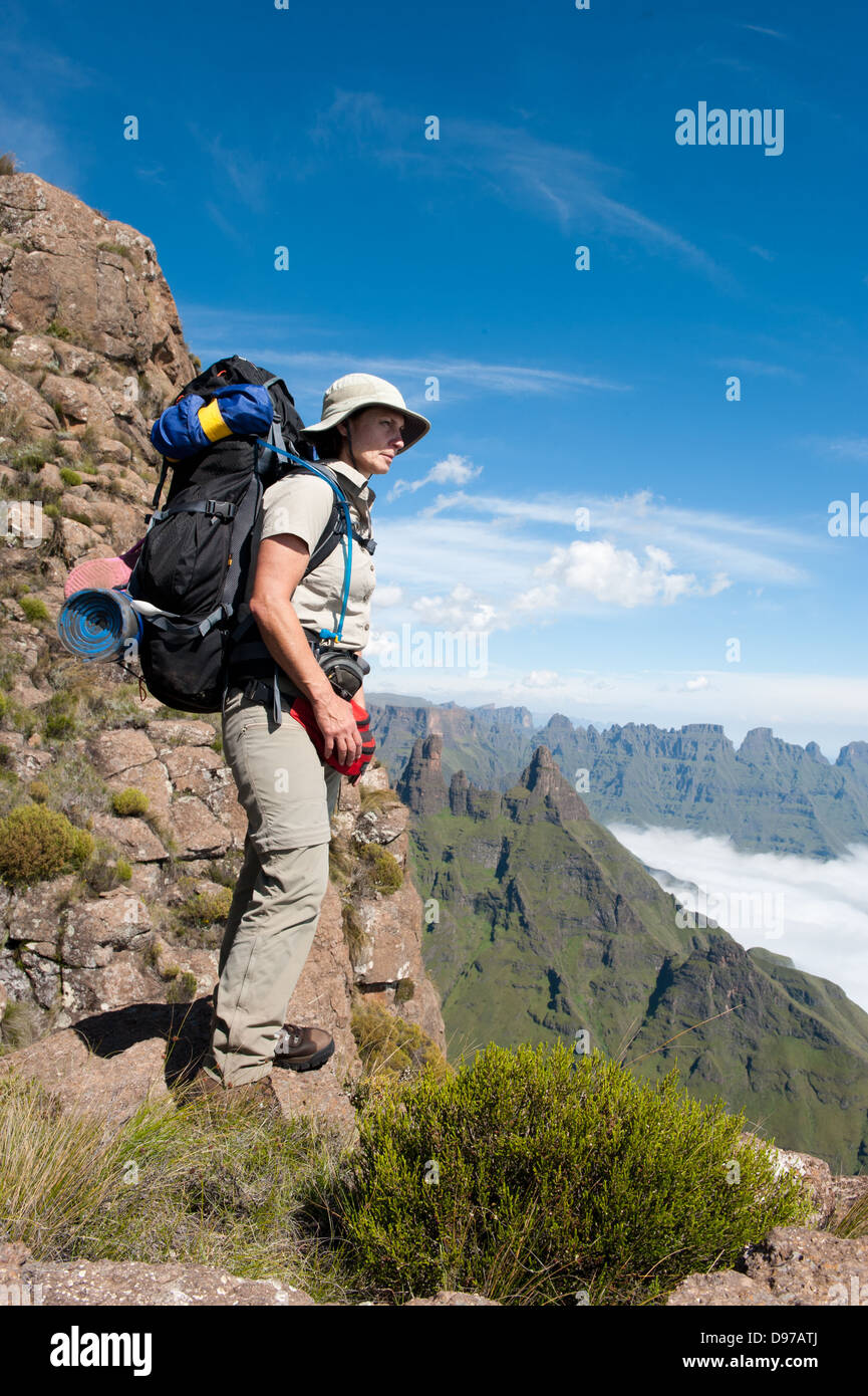 Hiker looking down the escarpment, Ukhahlamba Drakensberg Park, South Africa Stock Photo
