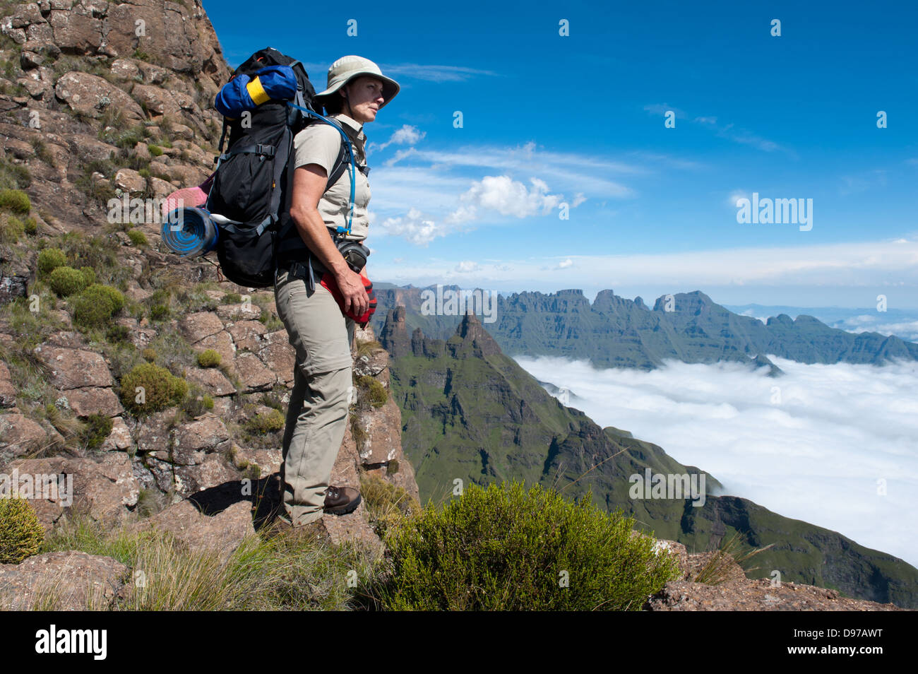 Hiker looking down the escarpment, Ukhahlamba Drakensberg Park, South Africa Stock Photo