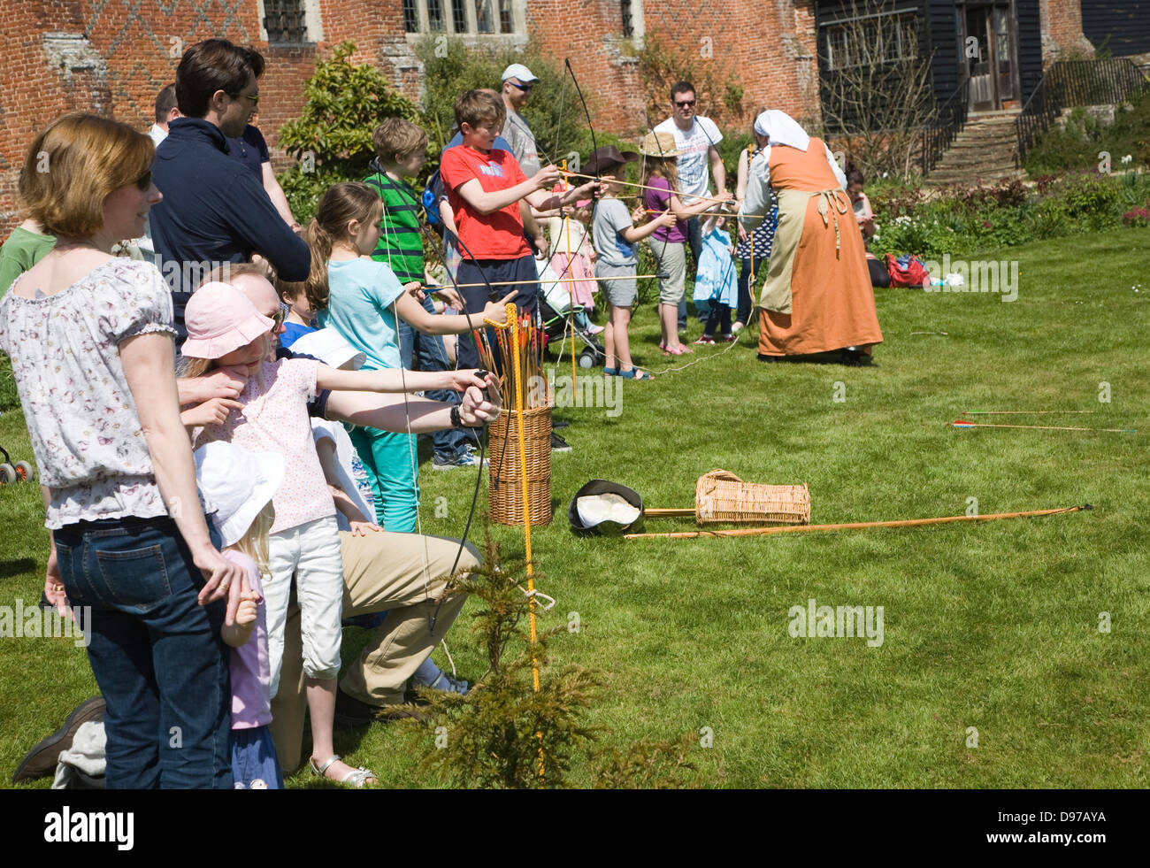 Children archery lesson during Tudor history day at Layer Marney, Essex, England Stock Photo