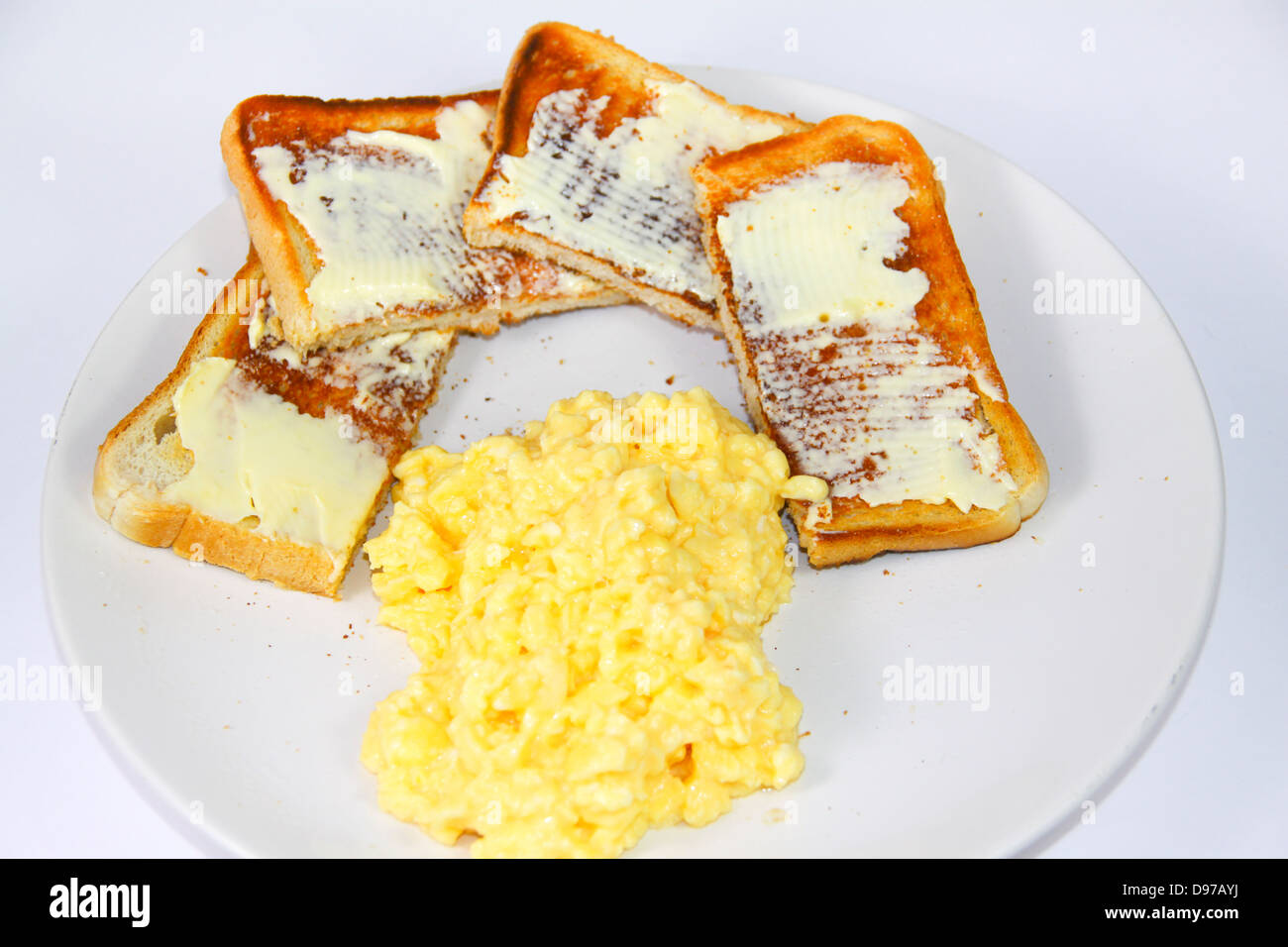 Scrambled egg and toast on plate Stock Photo - Alamy