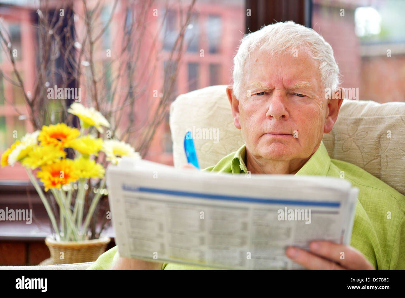 Seventies Man Active Retirement Lifestyle - Newspaper Concern Stock Photo