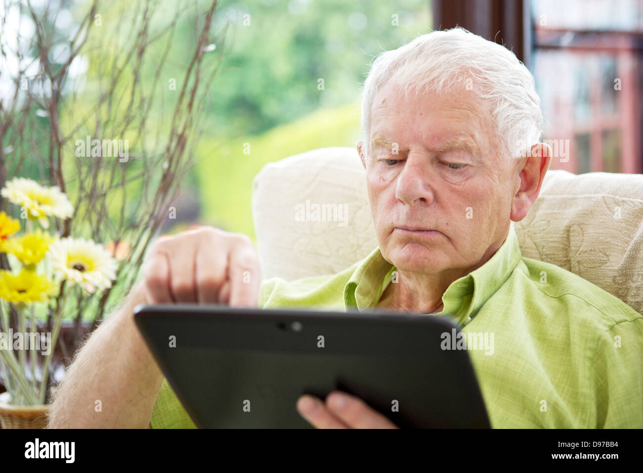 Seventies Man Technology Silver Surfer - Tablet Computer Stock Photo