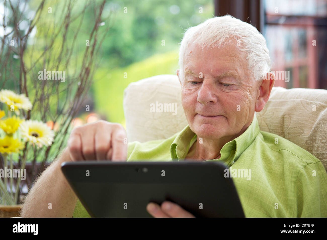 Seventies Man Tablet Computer -  Smiling Stock Photo